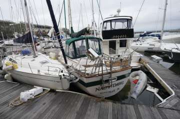  Storm damaged boats sit at the dock in a marina, Thursday, Sept. 17, 2020, in Pensacola, Fla. River