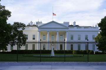 An American flag flies at half-staff over the White House in Washington, Saturday, Sept. 19, 2020. F