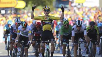 Belgium's Wout Van Aert crosses the finish line to win the fifth stage of the Tour de France cycling race over 183 kilometers (113,7 miles) with start in Gap and finish in Privas, southern France, Wednesday, Sept.2