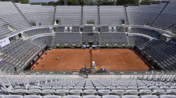 The stands around the Central Court of the Foro Italico are empty during a match between Serbia's Novak Djokovic and Italy's Salvatore Caruso, at the Italian Open tennis tournament in Rome, Wednesday, Sept. 16