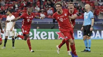 Bayern's Javi Martinez, center, celebrates with teammates after scoring his side's second goal during the UEFA Super Cup soccer match between Bayern Munich and Sevilla at the Puskas Arena in Budapest, Hungary, Thursday, Sept. 24