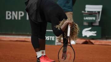 Serena Williams of the U.S. reacts after missing a shot against Kristie Ahn of the U.S. in the first round match of the French Open tennis tournament at the Roland Garros stadium in Paris, France, Monday, Sept. 28