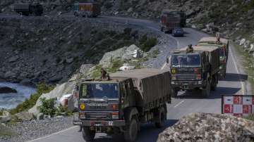 An Indian army convoy moves on the Srinagar- Ladakh highway at Gagangeer, northeast of Srinagar, Wednesday, Sept. 9, 2020. China and India have been engaged in a tense standoff in the cold-desert Ladakh region since May, and their defense ministers met Friday in Moscow in the first high-level direct contact between the sides since the standoff began. (AP Photo/ Dar Yasin)