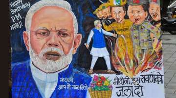 Mumbai: An artist makes a painting for Prime Minister Narendra Modi's 70th Birthday. PM Modi turns 7