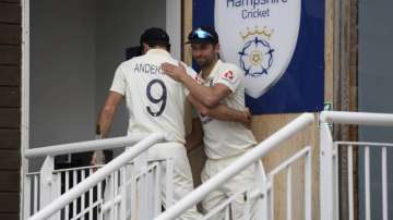 England's Mark Wood, right, hugs to congratulate teammate James Anderson at the end of the fifth day of the third cricket Test match between England and Pakistan, at the Ageas Bowl in Southampton, England, Tuesday, Aug. 25