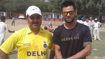 Virat Kohli with his childhood coach Rajkumar Sharma