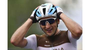 France's Nans Peters celebrates as he crosses the finish line to win the eighth stage of the Tour de France cycling race over 141 kilometers (87.6 miles) from Cazeres-sur-Garonne to Loudenvielle, France, Saturday, Sept. 5