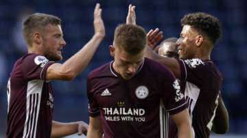 Leicester's Jamie Vardy, left, celebrates with teammates after scoring on a penalty kick during the English Premier League soccer match between West Bromwich and Leicester City at the Hawthorns in West Bromwich, England, Sunday, Sept.13, 2020
