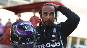 Mercedes driver Lewis Hamilton of Britain reacts after winning the Formula One Grand Prix of Tuscany, at the Mugello circuit in Scarperia, Italy, Sunday, Sept. 13