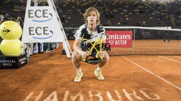 Andrey Rublev of Russia holds the trophy after his victory against Stefanos Tsitsipas of Greece at the ATP Tour - European Open in Hamburg, Germany, Sunday, Sept. 27