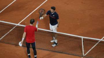Britain's Andy Murray congratulates Switzerland's Stan Wawrinka after Murray lost in three sets 1-6, 3-6, 2-6, in the first round match of the French Open tennis tournament at the Roland Garros stadium in Paris, France, Sunday, Sept. 27