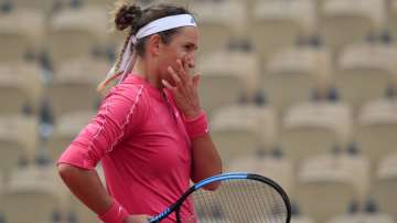 Victoria Azarenka of Belarus reacts after missing a shot against Slovakia's Anna Karolina Schmiedlova in the second round match of the French Open tennis tournament at the Roland Garros stadium in Paris, France, Wednesday, Sept. 30