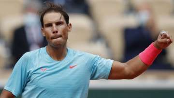 Spain's Rafael Nadal celebrates winning the second round match of the French Open tennis tournament against Mackenzie McDonald of the U.S. at the Roland Garros stadium in Paris, France, Wednesday, Sept. 30