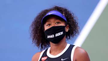 Naomi Osaka tosses racket, overcomes test from teenager at US Open