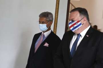 U.S. Secretary of State Mike Pompeo, right, and Indian Foreign Minister Subrahmanyam Jaishankar arrive to attend their meeting in Tokyo, Tuesday, Oct. 6, 2020, ahead of the four Indo-Pacific nations' foreign ministers meeting.