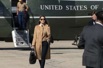Counselor to the President Hope Hicks walks from Marine One to accompany President Donald Trump aboa