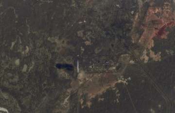 In this handout photo released by Roscosmos Space Agency, a view from the the International Space Station (ISS) as the Soyuz-2.1a rocket booster with Soyuz MS-17 space ship carrying a new crew to the International Space Station (ISS) blasts off at the Russian leased Baikonur cosmodrome, Kazakhstan, Wednesday, Oct. 14, 2020. A trio of space travelers has launched successfully to the International Spce Station, for the first time using a fast-track maneuver to reach the orbiting outpost in just three hours. NASA's Kate Rubins and Sergey Ryzhikov and Sergey Kud-Sverchkov of the Russian space agency Roscosmos lifted off as scheduled at 10:45 a.m. (1:45 a.m. EDT, 5:45 a.m. GMT) Wednesday from the Russia-leased Baikonur space launch facility in Kazakhstan for a six-month stint on the station.