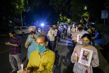 Members of Kerala Union of Working Journalists stage a candlelight vigil, demanding the release of journalist Siddique Kappan, in New Delhi