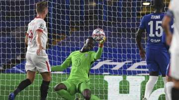 Chelsea's goalkeeper Edouard Mendy blocks the ball during the Champions League Group E soccer match between Chelsea and Sevilla at Stamford Bridge, London, England, Tuesday, Oct. 20