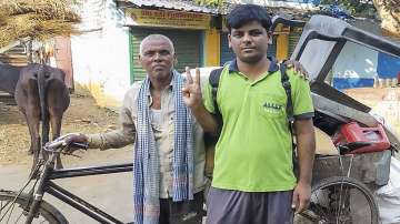 Arvind Kumar, who has secured All India rank 11603 and 4392 in OBC category, with his father Bhikhar