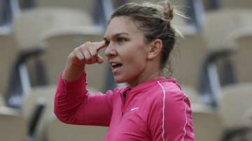 Romania's Simona Halep gestures in her match against Romania's Irina-Camelia Begu in the second round of the French Open tennis tournament at the Roland Garros stadium in Paris, France, Wednesday, Sept. 30