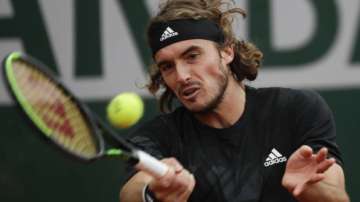 Greece's Stefanos Tsitsipas plays a shot against Slovenia's Aljaz Bedene in the third round match of the French Open tennis tournament at the Roland Garros stadium in Paris, France, Saturday, Oct. 3