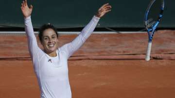 Italy's Martina Trevisan celebrates winning the fourth round match of the French Open tennis tournament against Netherlands' Kiki Bertens in two sets, 6-4, 6-4, at the Roland Garros stadium in Paris, France, Sunday, Oct. 4