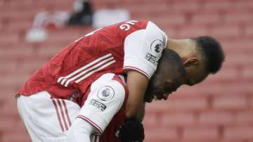 Arsenal's Nicolas Pepe, right, celebrates with teammate Arsenal's Pierre-Emerick Aubameyang after scoring his sides second goal during the English Premier League soccer match between Arsenal and Sheffield United at the Emirates Stadium in London, Sunday, Oct. 4