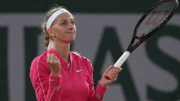 Petra Kvitova of the Czech Republic celebrates winning her fourth-round match of the French Open tennis tournament against China's Zhang Shuai in two sets 6-2, 6-4, at the Roland Garros stadium in Paris, France, Monday, Oct. 5