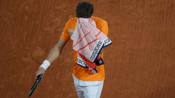 Spain's Pablo Carreno Busta wipes his face in the fourth round match of the French Open tennis tournament against Germany's Daniel Altmaier at the Roland Garros stadium in Paris, France, Monday, Oct. 5