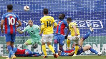 Brighton's Neal Maupay, right gets his shot deflected over the bar during an English Premier League soccer match between Crystal Palace and Brighton at the Selhurst Park stadium in London, England, Sunday Oct. 18