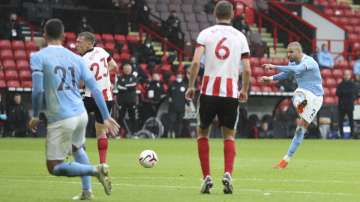 Manchester City's Kyle Walker, right, scores his side's opening goal during the English Premier League soccer match between Sheffield United and Manchester City at Bramall Lane stadium in Sheffield, England, Saturday, Oct. 31