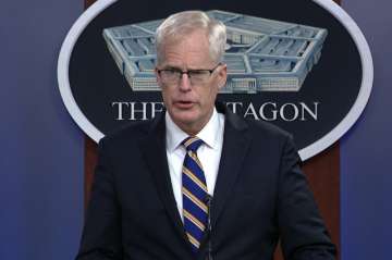 In this Tuesday, Nov. 17, 2020, image taken from a video provided by Defense.gov Acting Defense Secretary Christopher Miller speaks at the Pentagon in Washington. Miller said Tuesday that the U.S. will reduce troop levels in Iraq and Afghanistan by mid-January, asserting that the decision fulfills President Donald Trump’s pledge to bring forces home from America's long wars even as Republicans and U.S. allies warn of the dangers of withdrawing before conditions are right.