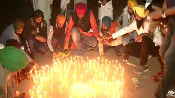 Punjab farmers at Singhu border pray, light diyas' on Guru Nanak Jayanti