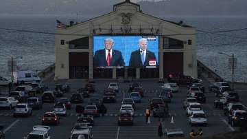 People watch from their vehicles as Donald Trump and Joe Biden speak during a Presidential Debate Watch Party at Fort Mason Center in San Francisco on October 22.