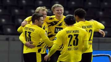 Dortmund beat Hertha Berlin 5-2 to move second on Saturday.