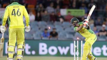 Australia's Glenn Maxwell, right, is bowled by India's Jasprit Bumrah during their one day international cricket match at Manuka Oval in Canberra, Australia, Wednesday, Dec. 2