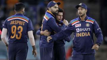 India's Virat Kohli, second left, celebrates with teammates after defeating Australia in their one day international cricket match at Manuka Oval in Canberra, Australia, Wednesday, Dec. 2, 2020. India won the match by 13 runs