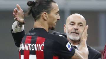 In this Saturday, Oc.t 17, 2020 file photo, AC Milan manager Stefano Pioli, right, congratulates Zlatan Ibrahimovic at the end of the Serie A soccer match between Inter Milan and AC Milan