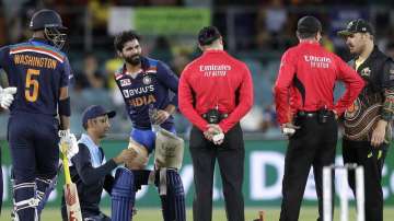 India's Ravindra Jadeja, third left, has a trainer tend to his leg during a break in batting against Australia during their T20 international cricket match at Manuka Oval, in Canberra, Australia, Friday, Dec 4