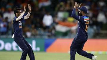 India's Sanju Samson, right celebrates with teammate India's Deepak Chahar after taking catch to dismiss Australia's Steve Smith during their T20 international cricket match at Manuka Oval, in Canberra, Australia, Friday, Dec 4