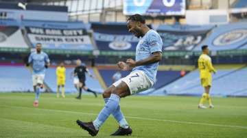 Manchester City's Raheem Sterling celebrates after scoring the opening goal during an English Premier League soccer match between Manchester City and Fulham at the Etihad stadium in Manchester, England, Saturday, Dec. 5