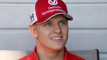 In this Thursday, Nov. 28, 2019 file photo, German Formula Two driver Mick Schumacher talks to the journalists at the Yas Marina racetrack in Abu Dhabi