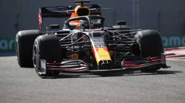 Red Bull driver Max Verstappen of the Netherlands steers his car during the first free practice at the Yas Marina racetrack in Abu Dhabi, United Arab Emirates, Friday, Dec. 11