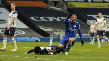 Leicester's Jamie Vardy, right reacts and celebrates after Tottenham's Toby Alderweireld, left scored an own goal for Leicester's second goal of the game during the English Premier League soccer match between Tottenham Hotspur and Leicester City at the White Hart Lane stadium in London Sunday, Dec. 20