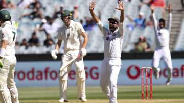 India's Ajinkya Rahane, appeals successfully for the dismissal of Australia's Cameron Green, second left, during play on day one of the Boxing Day cricket test between India and Australia at the Melbourne Cricket Ground, Melbourne, Australia, Saturday, Dec. 26