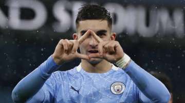 Manchester City's Ferran Torres celebrates after scoring his side's second goal during the English Premier League soccer match between Manchester City and Newcastle United at the Etihad Stadium in Manchester, England, Saturday, Dec., 26
