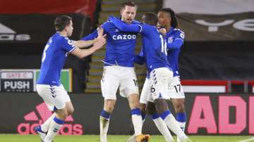 Everton's Gylfi Sigurdsson, center, celebrates with teammates after scoring their side's first goal during the English Premier League soccer match between Sheffield United and Everton at the Bramall Lane stadium in Sheffield, England, Saturday, Dec. 26