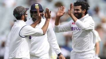 India's Ravindra Jadeja, right, celebrates after taking the wicket of Australia's Matthew Wade during play on day three of the second cricket test between India and Australia at the Melbourne Cricket Ground, Melbourne, Australia, Monday, Dec. 28