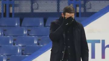 Chelsea's head coach Frank Lampard covers his face during the English Premier League soccer match between Chelsea and Aston Villa in London, England, Monday, Dec. 28
